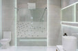 Bathroom interior with white walls, a shower cabin with glass wa