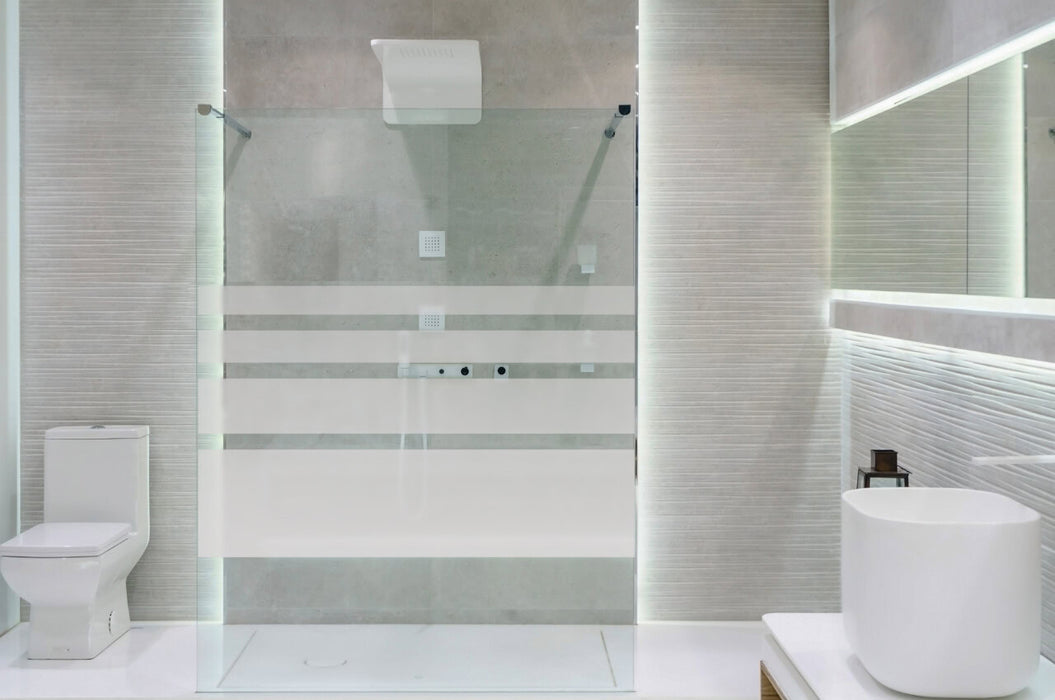 Bathroom interior with white walls, a shower cabin with glass wa