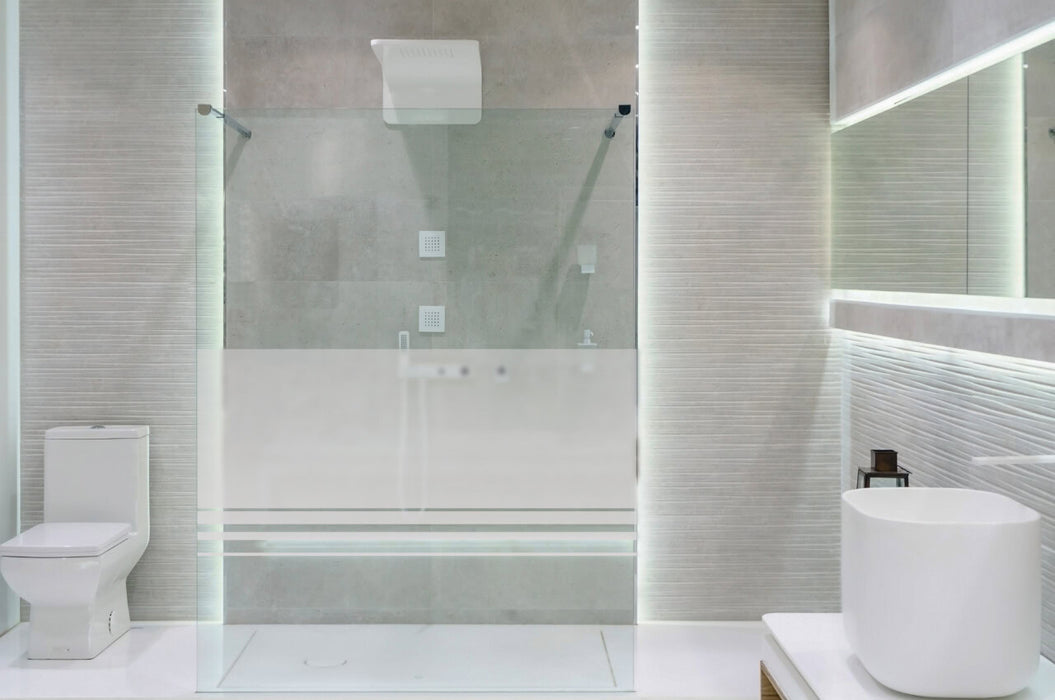 Bathroom interior with white walls, a shower cabin with glass wa