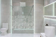 Bathroom interior with white walls, a shower cabin with glass wa