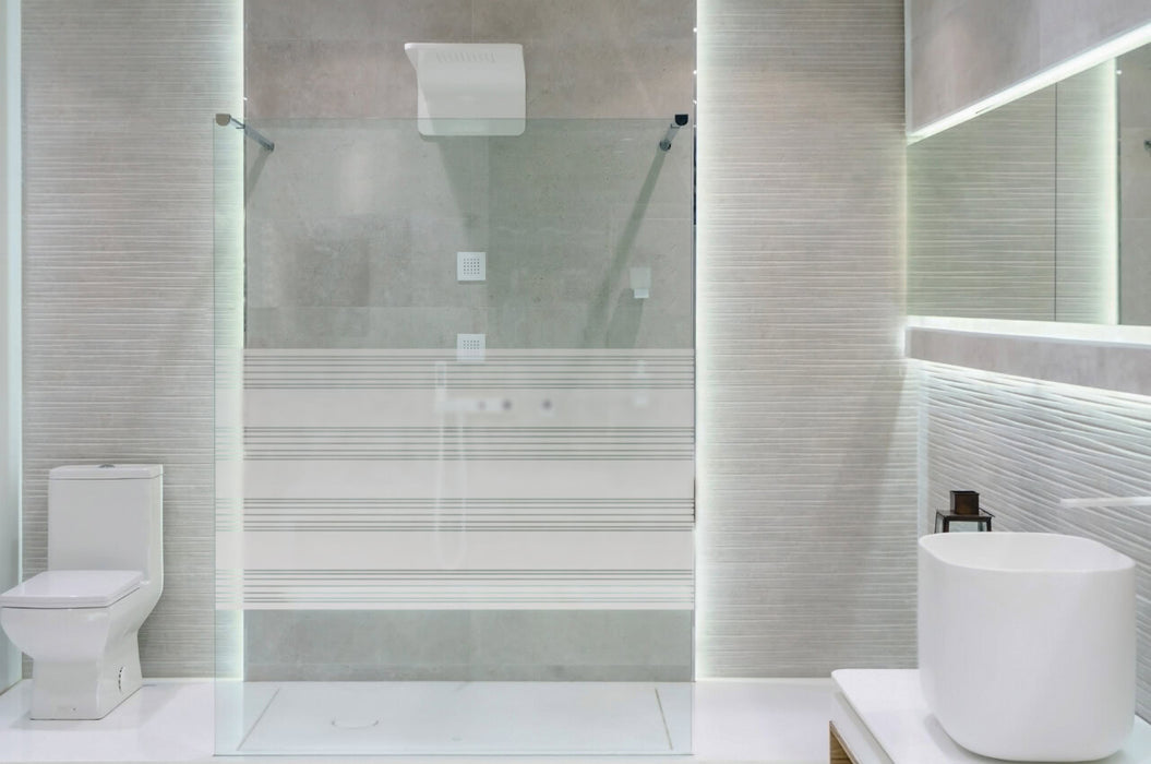 Bathroom interior with white walls, a shower cabin with glass wa