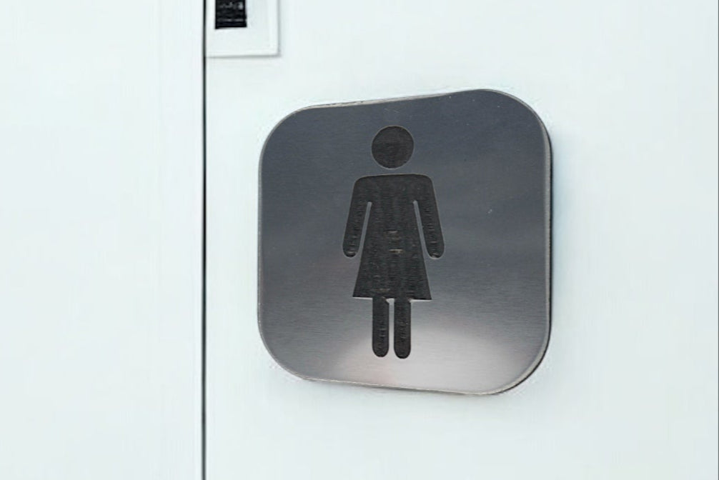 Placa de Aseos en Bicapa con Pictograma